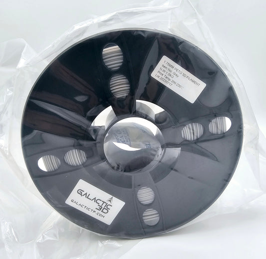 A spool of gray filament is shown wrapped in plastic.