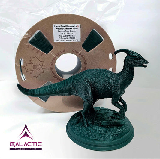 A dinosaur is shown in front of a spool of Spruce Green filament.