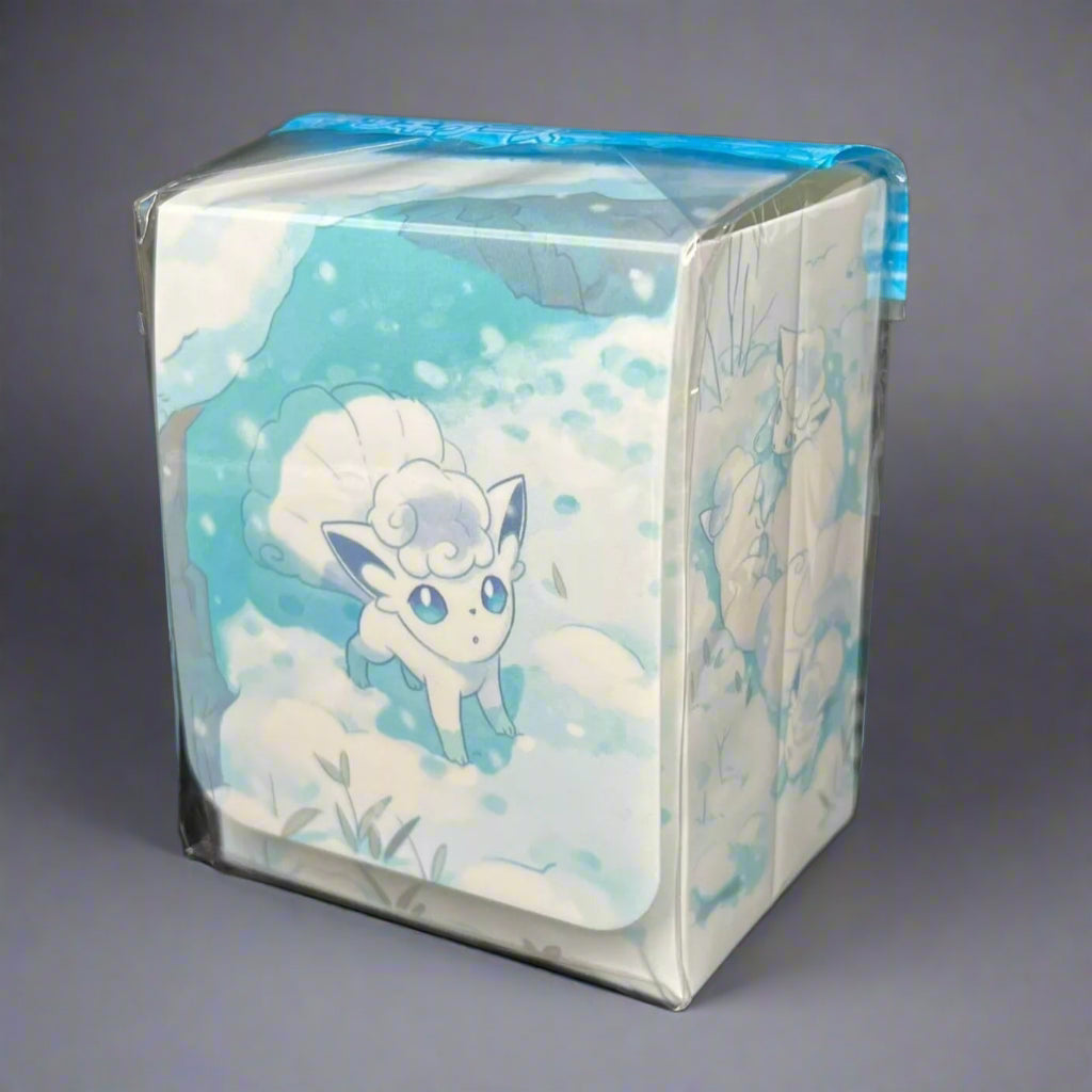 a white deck box with alolan vulpix is situated in front of a gray background.