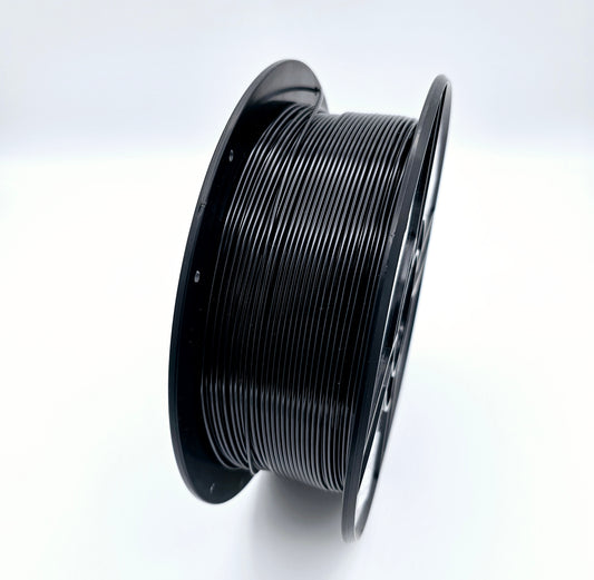 An open spool of black filament is shown