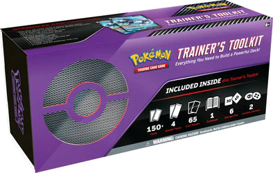 A purple box reads "Trainer's Toolkit" and notes the contents, including 65 sleeves, 150 cards, 4 booster packs, 1 manual, 6 dice, and 2 counters.